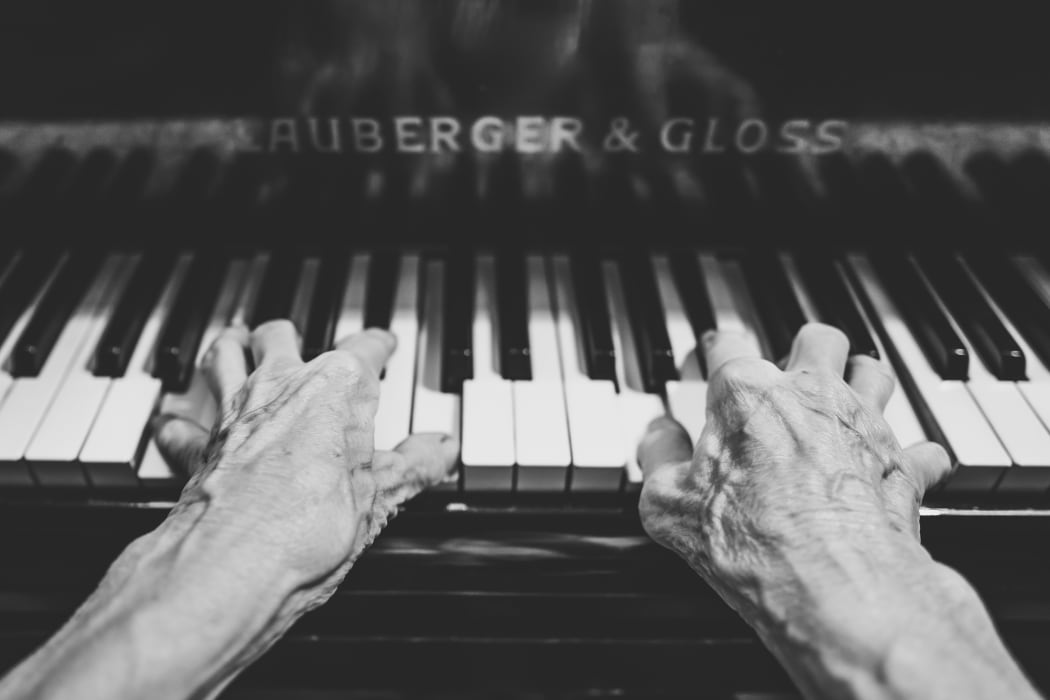 elderly hands playing piano
