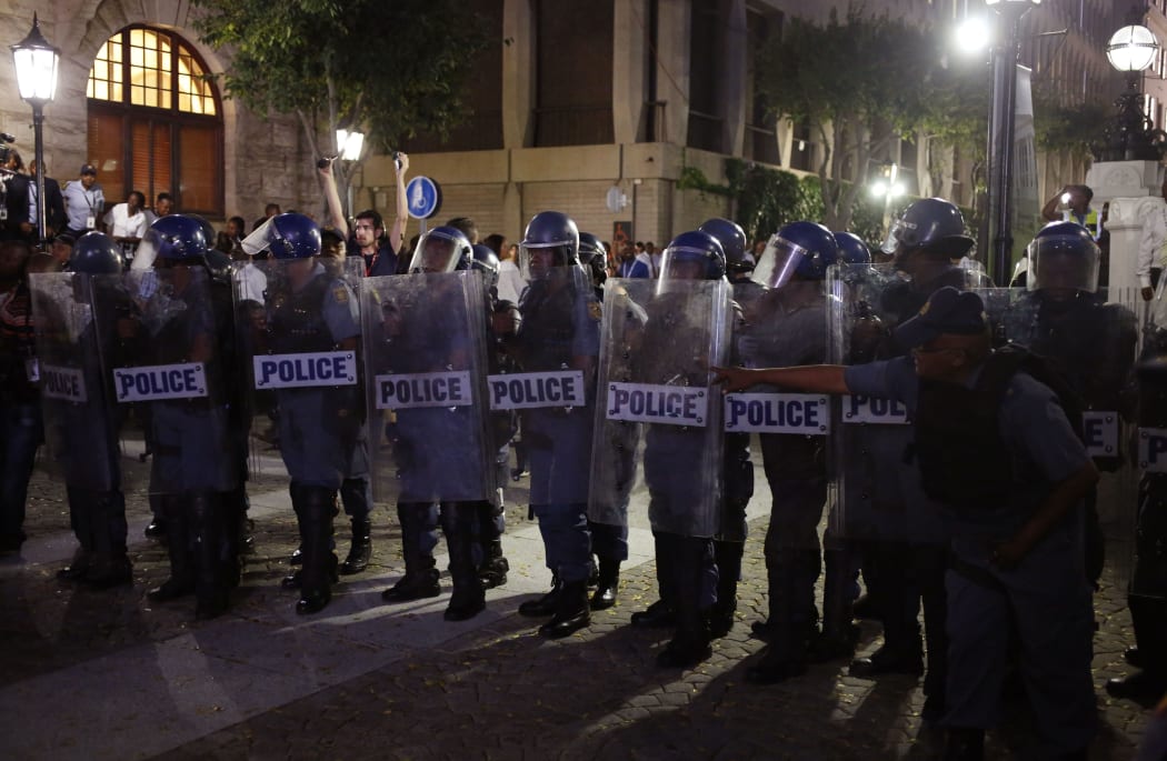 South African policemen stand guard in the streets