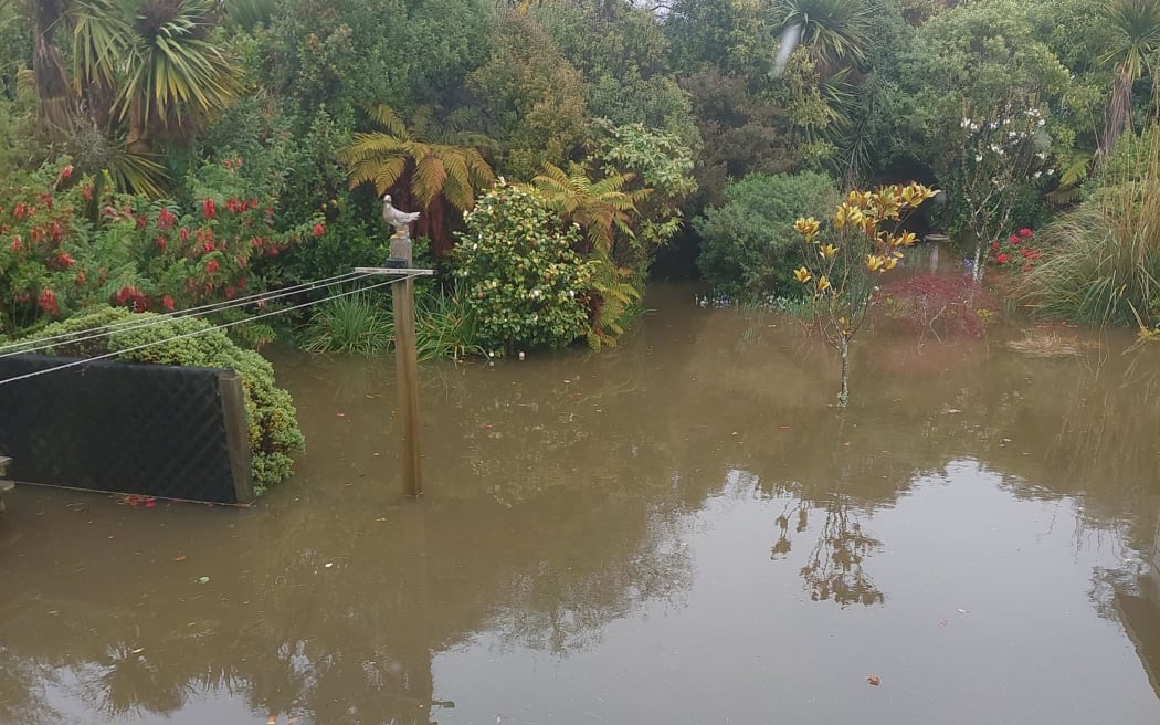 Tairei mouth flooding of backyard.
