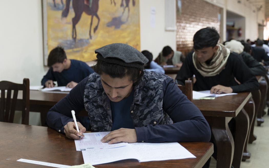Students take their university entrance exams at Kabul University in Kabul on 13 October, 2022.