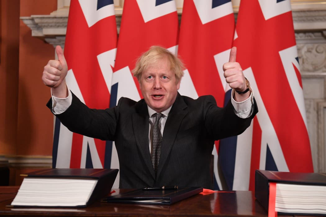 Boris Johnson gives a double thumbs up after signing the Trade and Cooperation Agreement between the UK and the EU, the Brexit trade deal, at 10 Downing Street in central London on 30 December  2020.