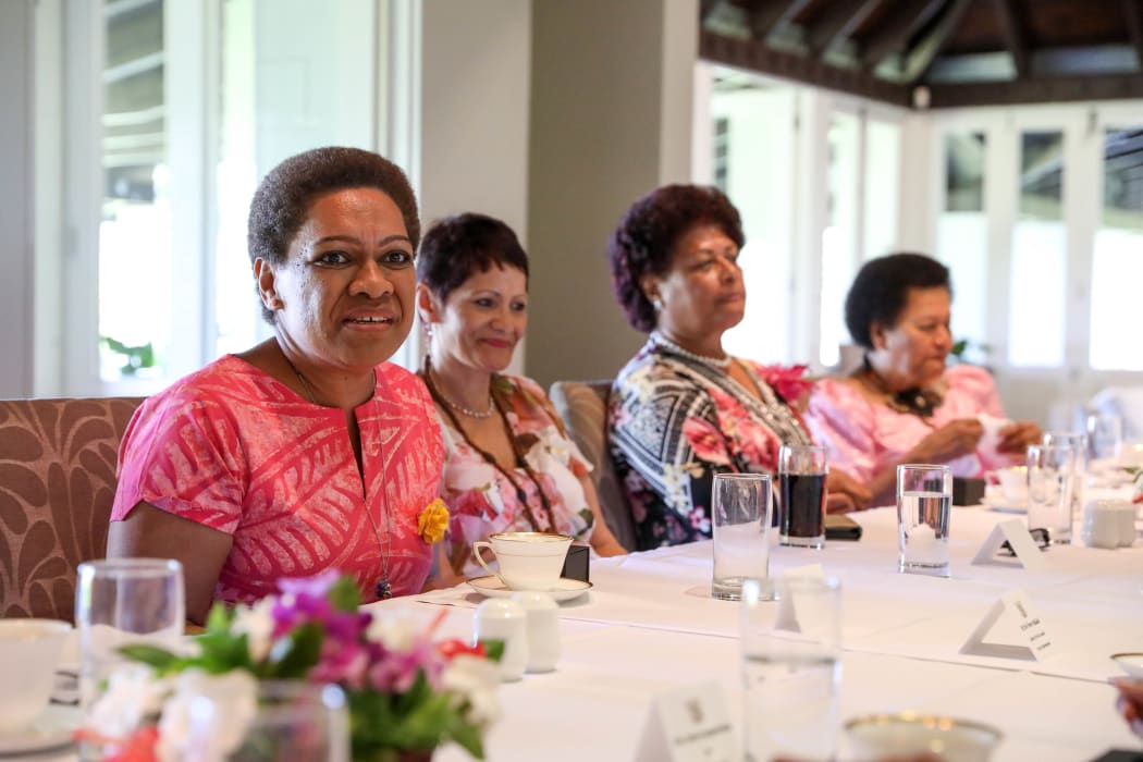 Minister for Women, Children, and Poverty Alleviation Mereseini Vuniwaqa thanks New Zealand Speaker Trevor Mallard for the camellia brooch gift.