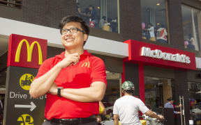 Henry Nguyen outside Vietnam's first McDonald's restaurant.