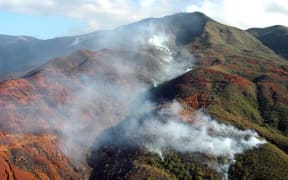 Aerial view of an area devastated by fire near Noumea, in New Caledonia, 28 December 2005.