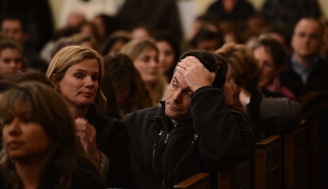 Mourners gather at a vigil service for victims of the Sandy Hook Elementary School shooting.