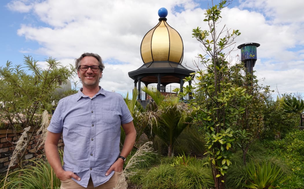 Hundertwasser Art Centre director Joost de Bruin in the building's roof forest.