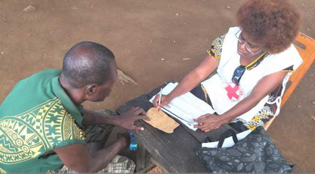 Household registration of people displaced by the Mt Ulawun volcano by PNG Red Cross Society at Bakada