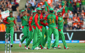 Bangladesh celebrate a wicket during the 2015 ICC Cricket World Cup match - New Zealand v Bangladesh, Seddon Park, Hamilton, New Zealand.