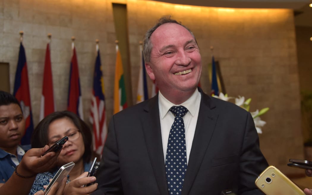 Australia's Agriculture Minister Barnaby Joyce (C) speaks to journalists in Jakarta on October 8, 2015.