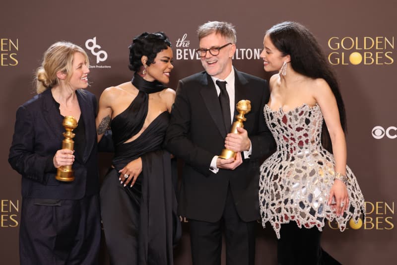(L/R) US film producer Sara Murphy, US actress Teyana Taylor, US filmmaker Paul Thomas Anderson and US actress Chase Infiniti, winners of the Best Motion Picture - Musical or Comedy Award for "One Battle After Another", pose in the press room during the 83rd annual Golden Globe Awards at the Beverly Hilton hotel in Beverly Hills, California