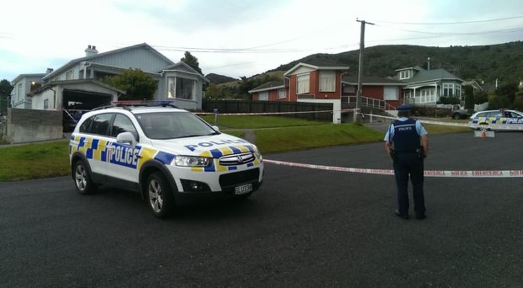 Police cars outside a house in Dunedin