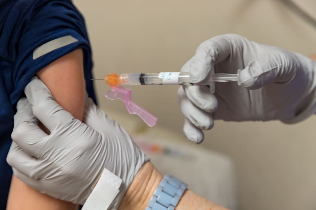 Nurse giving vaccine shot in arm of child, medical concept. (File image)