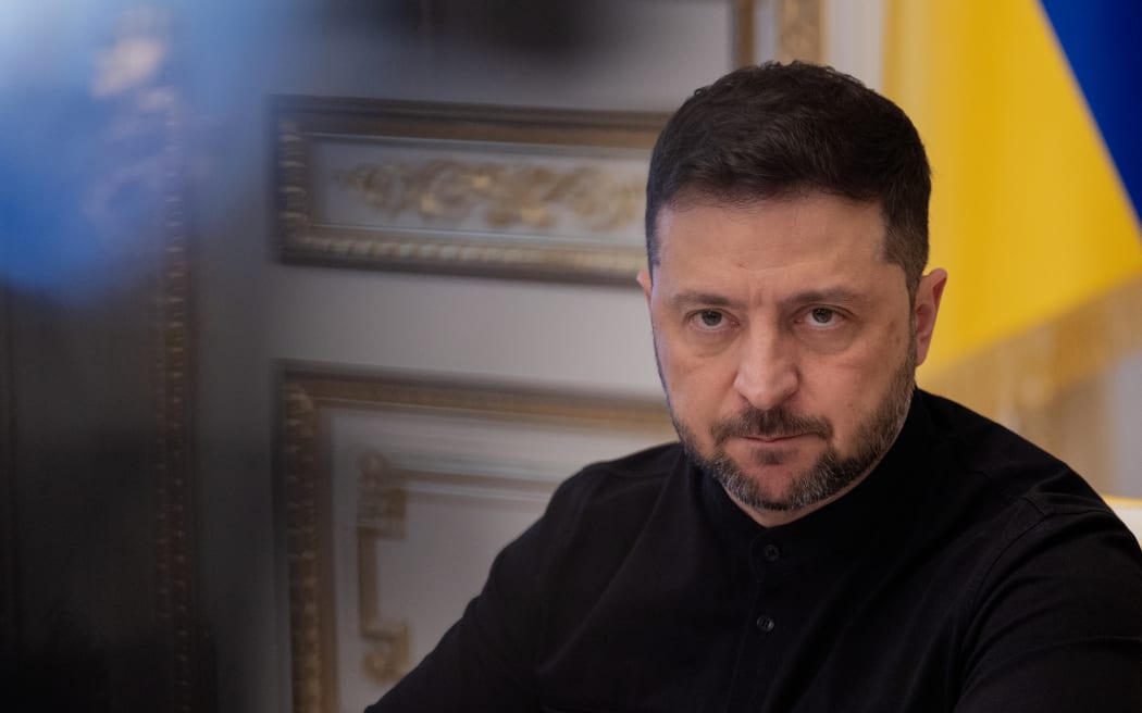 Ukraine's President Volodymyr Zelensky listens during a press conference in Kyiv on 31 October, 2025, amid the Russian invasion of Ukraine.