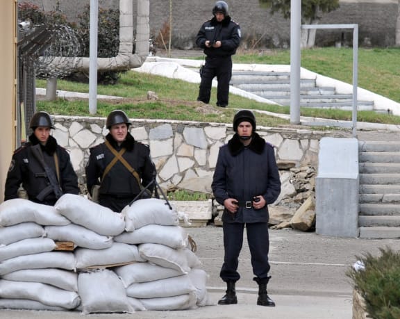 Ukrainian police standing guard at the Simferopol police base.