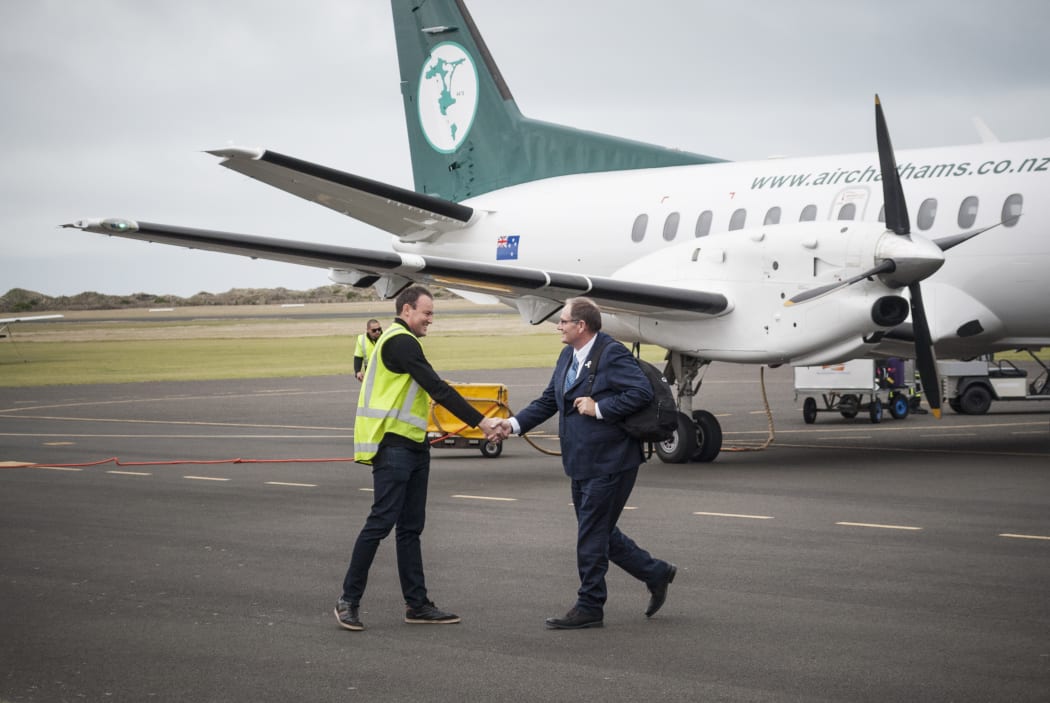 Air Chathams general manager Duane Emeny greets Whanganui MP Chester Borrows on his arrival from Auckland.