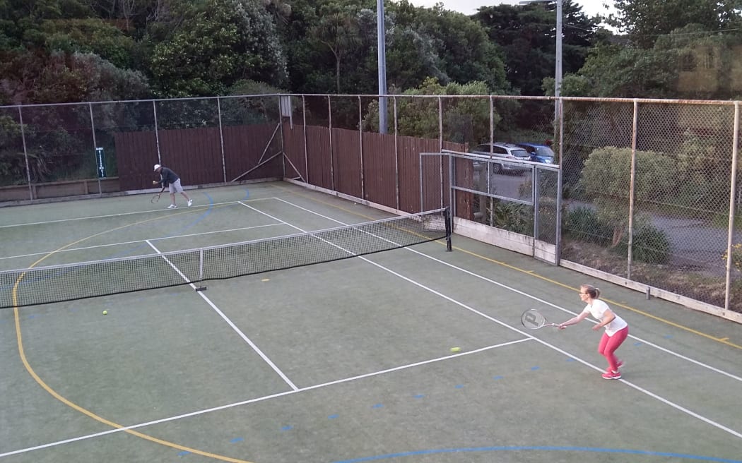 Paula Pollock getting ready for a serve from Jon Nanson - both are on the Newlands-Paparangi Tennis Club committee.
