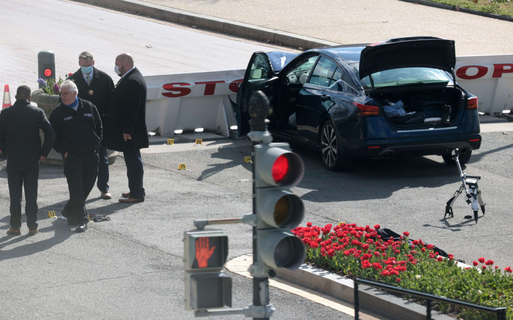 WASHINGTON, DC - APRIL 02: Law enforcement investigate the scene after a vehicle charged a barricade at the U.S. Capitol on April 02, 2021 in Washington, DC.