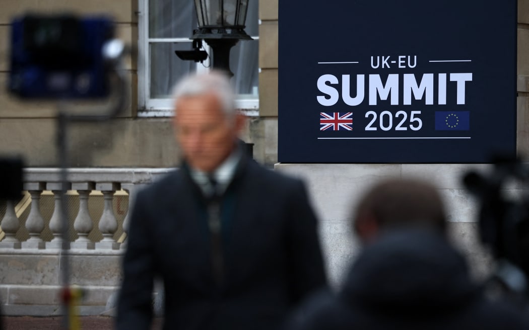 Members of the media work ahead of the UK-EU Summit at Lancaster House in London on May 19, 2025. UK Prime Minister Keir Starmer hosts European Union chiefs on Monday for a landmark summit designed to usher in a closer relationship between Britain and the bloc, five years after Brexit. (Photo by HENRY NICHOLLS / POOL / AFP)