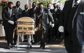 Pallbearers bring the coffin into the church for the funeral of George Floyd on June 9, 2020, in Houston, Texas