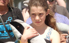girl with toy dolphin