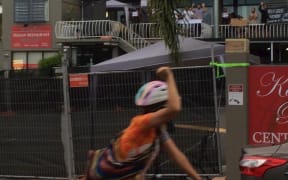 Refugees wave to a cyclist at the exercise protest in Brisbane.