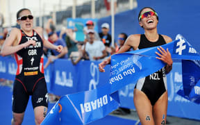 Andrea Hewitt crosses the line first in Abu Dhabi.