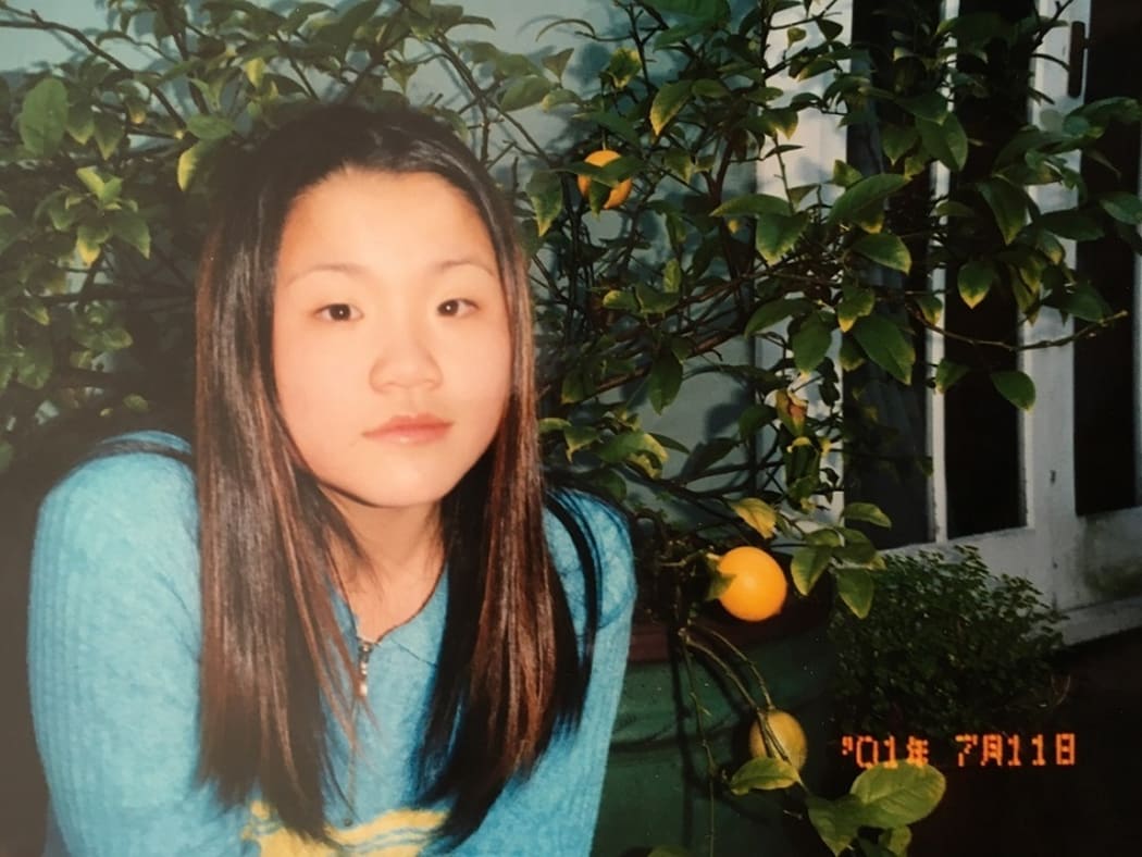 "Here I am 14, unhappy, sporting a middle part and overplucked eyebrows as was the fashion at the time."