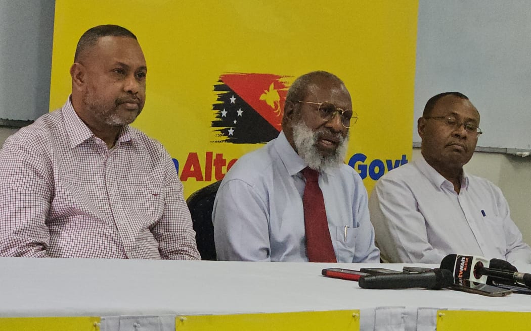 Kerenga Kua, middle, speaking to media. 29 February 2024
