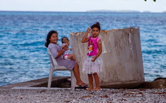 Children play on Nukunonu atoll in Tokelau.