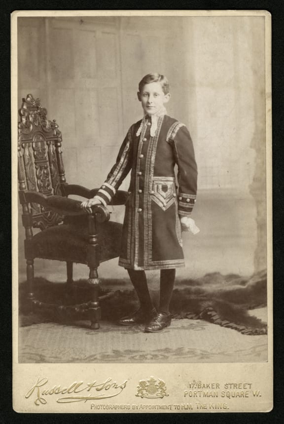 Portrait of William Manson as a child, wearing the uniform of a chorister of the Chapel Royal. Cabinet photograph, c.1906.