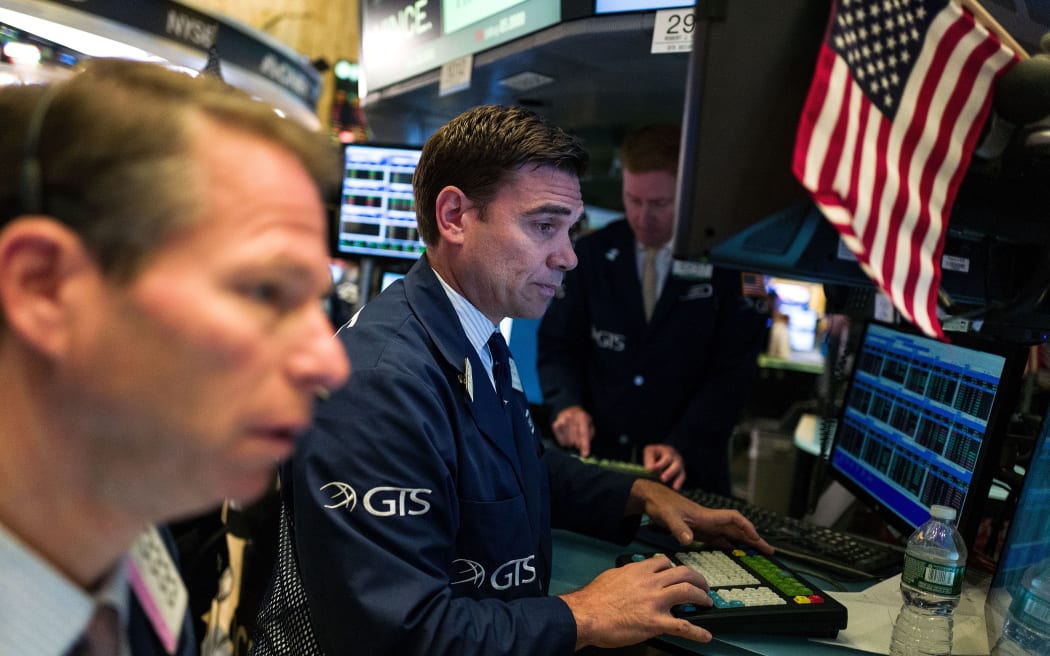 Traders and financial professionals work on the floor of the New York Stock Exchange, June 23, 2016 in New York City.