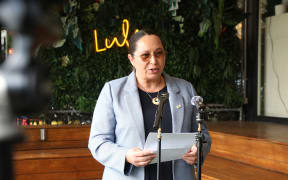Nicole McKee makes an alcohol announcement to media