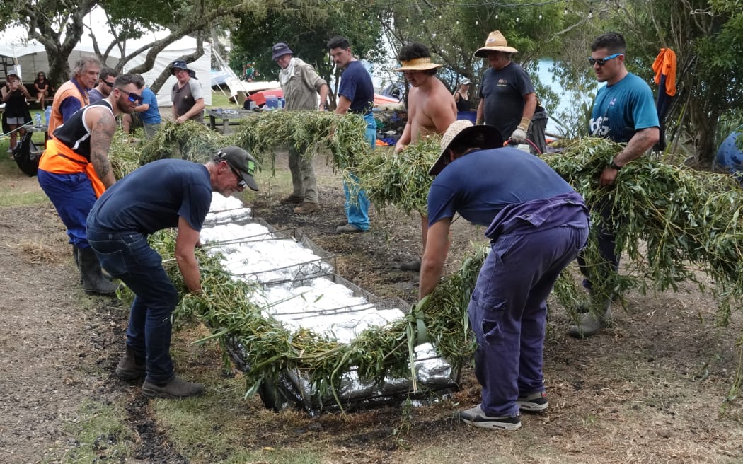 Willow branches secured with flax are used to seal the hāngī pit.