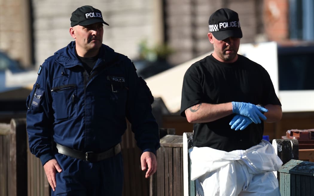 Police officers work at a residential property on Elsmore Road in Fallowfield, Manchester, to continue their investigations into the May 22 terror attack at the Manchester Arena.