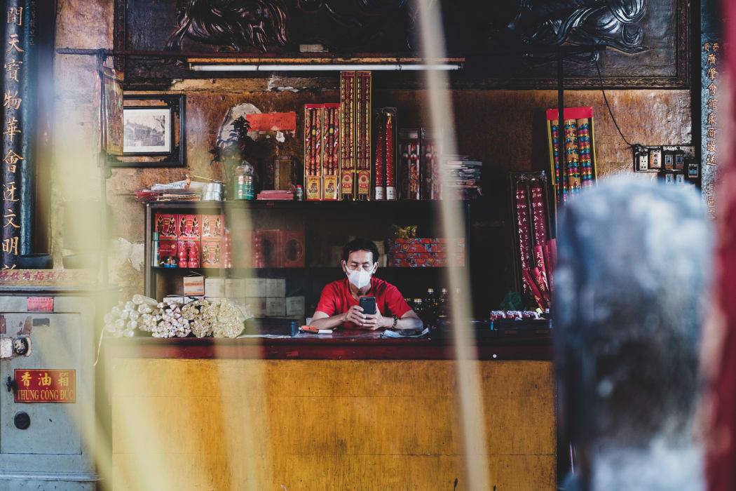 A man selling incense in Ho Chi Minh City, Vietnam, in February.