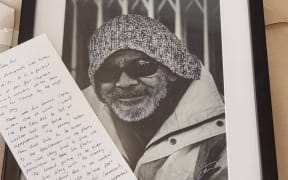 Portrait of Allan Adams with note from mystery photographer