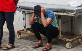 EDITORS NOTE: Graphic content / A Relative mourns loved ones killed during overnight strikes on Rafah in the southern Gaza Strip, at Al-Najjar hospital on November 12, 2023, amid the ongoing battles between Israel and the Palestinian militant group Hamas. More than 10,000 people have been killed in relentless Israeli bombardment of the Gaza Strip, according to the Hamas-run health ministry, since the war erupted last month after Palestinian militants raided southern Israel on October 7 killing at least 1200 people. (Photo by SAID KHATIB / AFP)