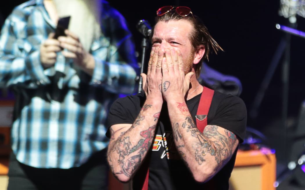 Frontman Jesse Hughes blows a kiss before the start of the concert at the Olympia concert hall.