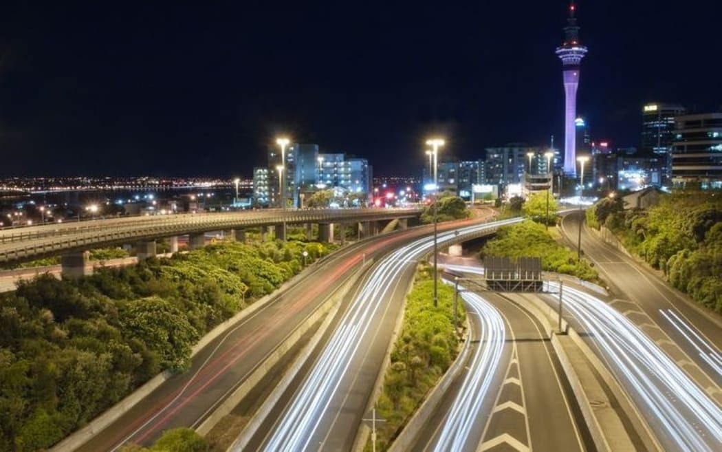 Auckland streets at night with long exposure turning  car headlights to light  ribbons