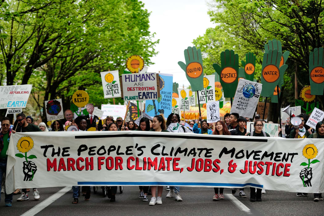 Protesters take part in the People's Climate March in Portland, US.