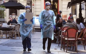 Health department officials arrive to inspect a restaurant and bar in Melbourne on May 12, 2021.