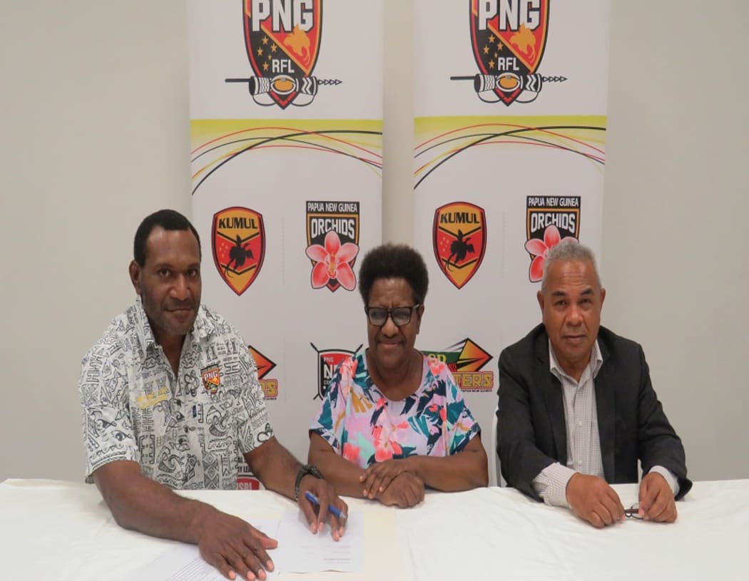 New PNG Orchids coach Nigel Hukula, with Executive Management Committee Chair Ms Ruth Waram and PNGRFL CEO Reatau Rau.