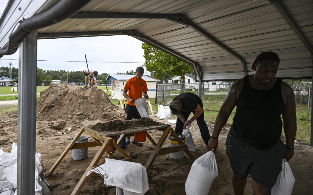 People preparing sand bags ahead of the arrival of Hurricane Helene in Crawfordville, Florida, on 25 September, 2024.