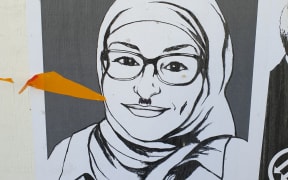 A poster near Dunedin's Exchange was meant to promote unity but has the opposite effect after being defaced.