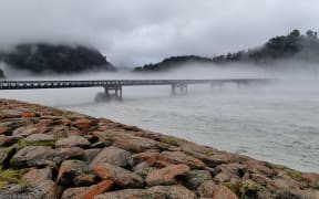 The Waiho Bridge levels are dropping following severe heavy rain in the Westland are on 19 January 2024. Picture taken morning on 20 January 2024.