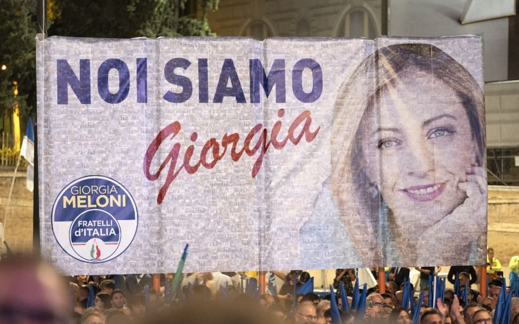 A banner depicting the Fratelli d'Italia leader Giorgia Meloni is displayed at Piazza del Popolo in Rome.