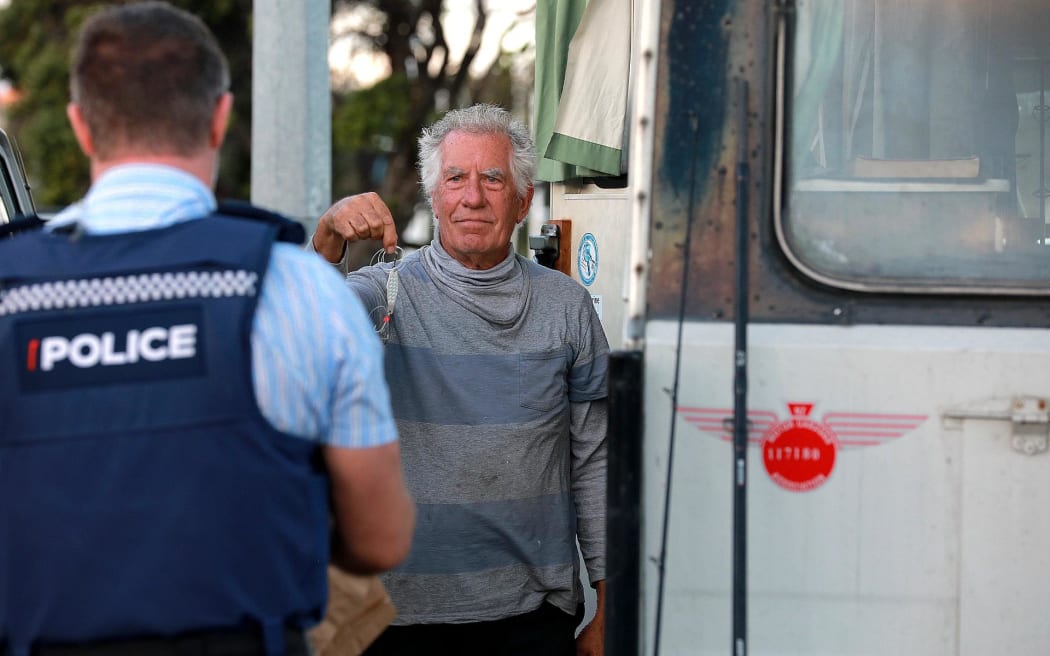 Paul Middleton hands over the lure that snagged body wrapped in rubbish bags from the water at Gulf Harbour.