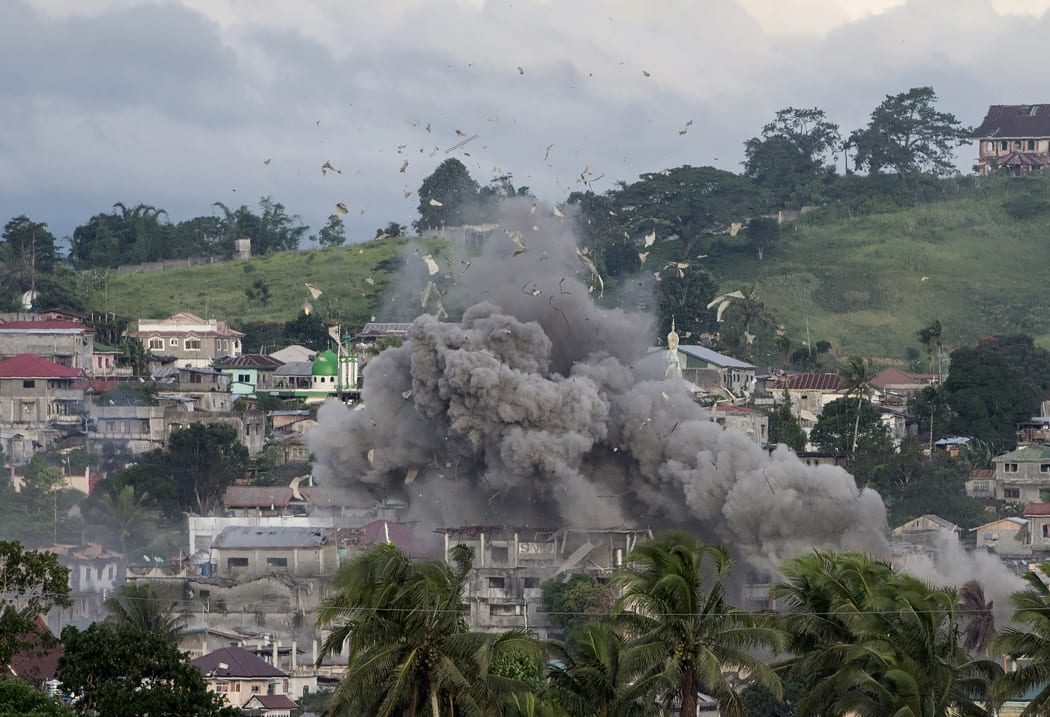 A bomb explodes after being dropped on an Islamist militants' hideout in Marawi on Friday.
