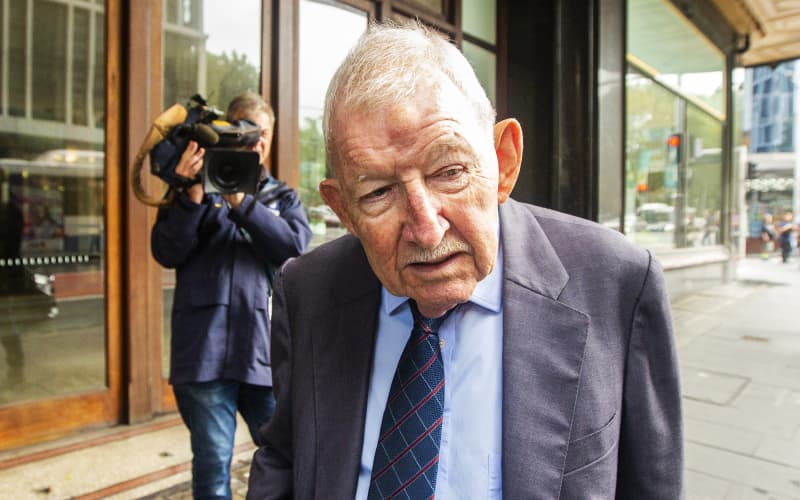 SYDNEY, AUSTRALIA - FEBRUARY 10: Ron Brierley leaves the  Downing Centre Local Court on February 10, 2020 in Sydney, Australia. The 82 year old was arrested at Sydney International Airport on Tuesday 17 December 2019 on his way to Fiji. Brierley’s arrest follows an investigation by Eastern Suburbs Police Area Command, launched in August, into child abuse material in the area. Brierley was stopped at the airport by Australian Border Force officers. Detectives searched his carry-on luggage before the contents of his laptop and electronic storage devices were reviewed. He has been charged with six counts relating to the possession of child pornography. (Photo by Jenny Evans/Getty Images)