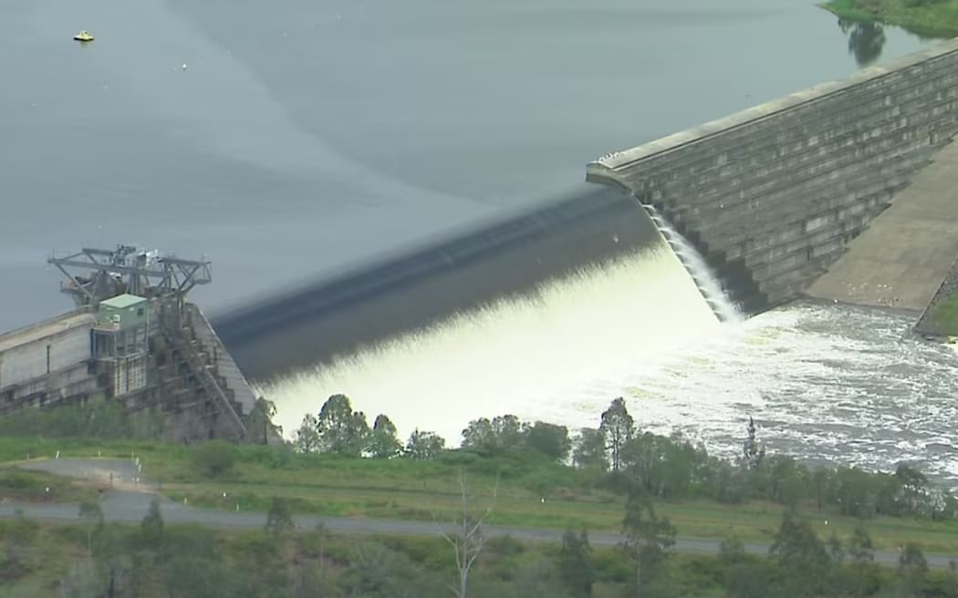 The Wyaralong Dam, a spillway in south-east Queensland, spilling over.